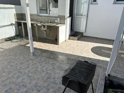 a bathroom being remodeled with a sink and a table at Casa do Outeiro - T2 Quarteira velha in Quarteira