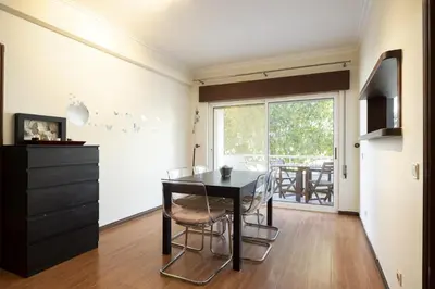 a dining room with a black table and chairs at Vilamoura fresh by Hd in Vilamoura