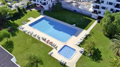 an overhead view of a large swimming pool in a yard at Vilamoura Downtown by Homing in Vilamoura