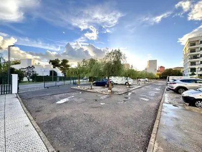 a parking lot with cars parked on the street at Vilamoura Downtown by Homing in Vilamoura