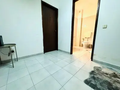 a room with a door and a tiled floor at Apartamento gourmet com quintal in Albufeira