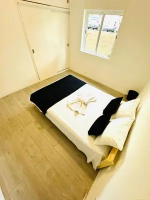 a small room with a bed with a window at Amazing Space - 4 Bedroom in Albufeira