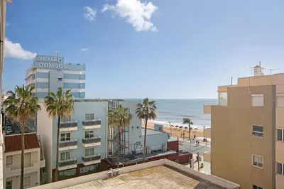 a view of the beach from a hotel condominium at Abertura Mar Zen in Quarteira