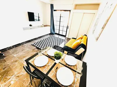 a dining room with a table and chairs at Studio com vista para Rua da Oura - Albufeira in Albufeira