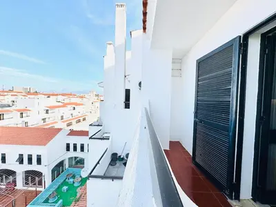a balcony with a view of a building at Condominio privado T1 Rua da Oura in Albufeira