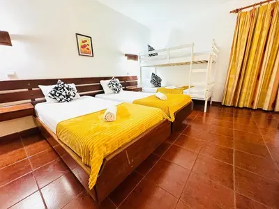 a bedroom with two beds and a bunk bed at Resort Albufeira T1, Oura Beach in Albufeira
