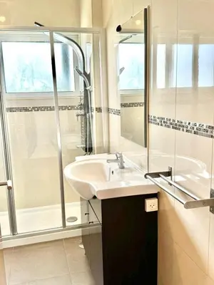 a bathroom with a sink and a shower at Duplex Apartment Albufeira in Albufeira