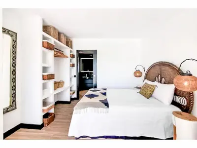a bedroom with a white bed and shelves at Holiday Home Gina - Sunny Way by Interhome in Albufeira