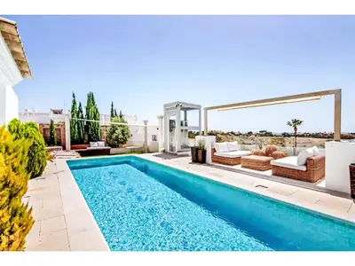 a swimming pool in the middle of a living room with a couch at Holiday Home Gina - Sunny Way by Interhome in Albufeira
