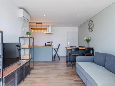 a kitchen and dining room with a table and chairs at Apartment Viva One - Vip Properties by Interhome in Albufeira