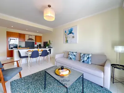 a living room with a couch and a table at Two Bedroom Apartment with Sea Views in Albufeira in Albufeira