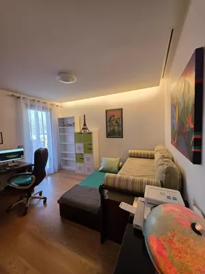 a bedroom with a bed and a desk with a computer at Casa dos sonhos em Vale do Lobo in Loulé