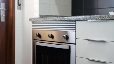 a kitchen with an oven with a counter top at Cosy 3Bdr Flat near University by LovelyStay in Faro