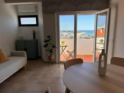 a living room with a couch and a table at Pipos d'Al-buhera in Albufeira