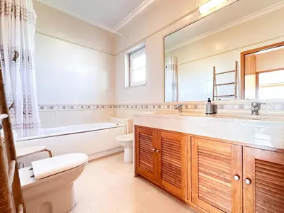 a bathroom with a tub and a toilet and a sink at Balaia Maggs House Pool & Ocean view by BeCherish in Albufeira