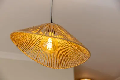 a yellow lamp hanging from a ceiling at Peaceful 2Bdr with Pool in Vilamoura by LovelyStay in Quarteira