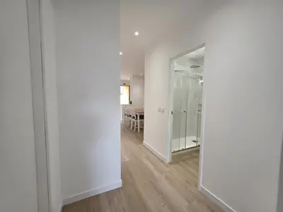 an empty room with white walls and a mirror at Barca do Lago Oasis by SAPvillas in Quarteira