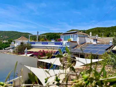 a house with solar panels on the roof at Holiday Home Vila Verão Nur für Erwachsene by Interhome in Santa Bárbara de Nexe