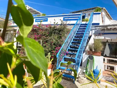 a staircase leading up to a house with flowers at Holiday Home Vila Primaveira - Nur für Erwachsene by Interhome in Santa Bárbara de Nexe