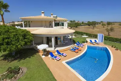 an aerial view of a house with a swimming pool at Villa Anthony by Villa Plus in Terras Novas