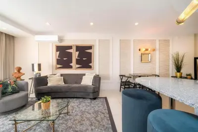 a living room with a couch and a table at Casa do Gil, Vale do Lobo Beach and Golf in Loulé