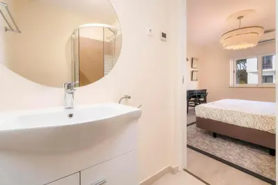 a bathroom with a sink and a mirror at Casa do Gil, Vale do Lobo Beach and Golf in Loulé