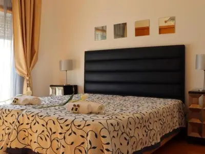 a bedroom with a bed with two stuffed animals on it at Vila Girassol by Stay ici Algarve Holiday Rental in Albufeira