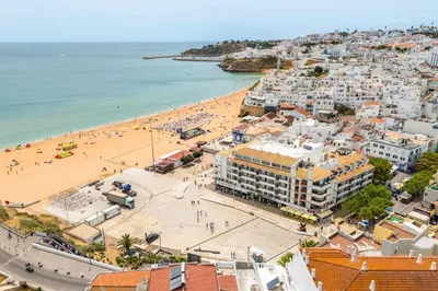 an aerial view of a beach and the ocean at Rocco del Mar by Portucasa in Albufeira