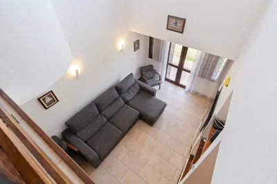 an overhead view of a living room with a couch and chairs at Villa Navegante com Piscina Privada em Vilamoura in Quarteira