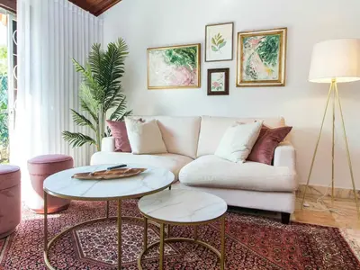 a living room with a couch and a table at Algarve Sun by Stay ici - Algarve Holiday Rental in Albufeira