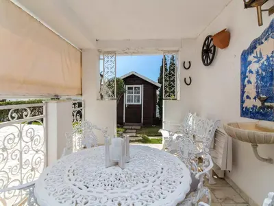 a dining room with a white table and chairs at Algarve Sun by Stay ici - Algarve Holiday Rental in Albufeira