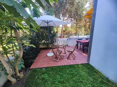 a small kitchen with a sink and a stove at T2 Apartment with private garden in the Balaia Apartments, Albufeira, Algarve in Atalaia