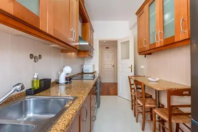 a kitchen with a sink and a counter top at Cosy 2Bdr Flat in Faro Downtown by LovelyStay in Faro