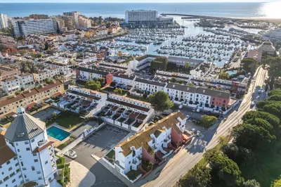 an aerial view of a city with a harbor at Marina Búzios Vilamoura Central 2-Bedroom Apartments in Vilamoura