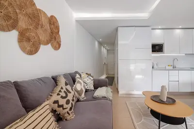 a living room with a couch and a table at Marina Mar in Vilamoura