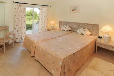 a bedroom with a large bed in a room at Superior Two Bedroom Apartment in Clube Albufeira in Albufeira