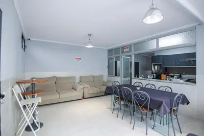 a living room with a table and a couch at QUANICE - Relaxing Guest House in Faro in Faro