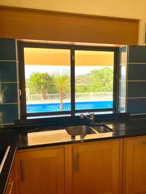 a kitchen with a sink and a window with a view at Casa Mariano Private Heated Pool With Views and AC
