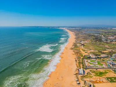 two boats in the water next to a beach at Villa Atlantis by Algarve Vacation in Guia