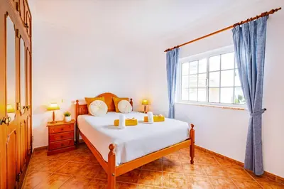 a bedroom with a bed and a window at Villa Atlantis by Algarve Vacation in Guia