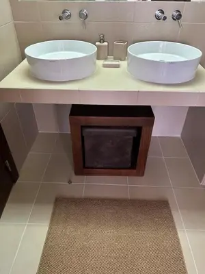 a bathroom with a sink and a large tub at Vila das Lagoas 9A 3D in Guia