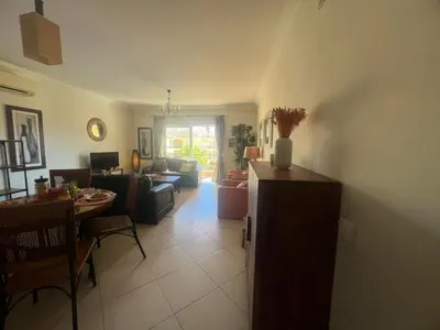 a living room with a couch and a table at Praia Village by Garvetur in Quarteira