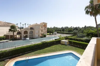 a view of a house and a swimming pool at Alva - cozy apartment with pool by HD in Vilamoura
