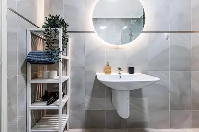 a bathroom with a sink and a mirror at Le Bleu de la Mer in Albufeira
