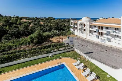 a view of a swimming pool and a building at Le Bleu de la Mer in Albufeira