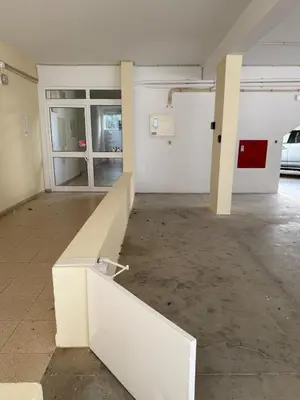 an empty room with a white bench in a building at Vilamoura View Apartment in Quarteira