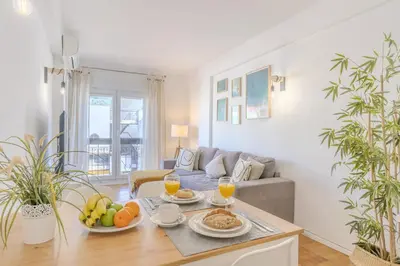 a living room with a table with food on it at #347 Albufeira Dream Home by Home Holidays in Albufeira