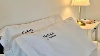 a white bed with two pillows on top of it at Villa Albatros Cleverdetails, Vilamoura, private pool and jacuzzi in Vilamoura