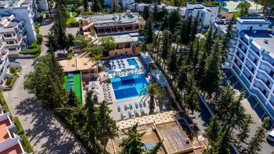 an overhead view of a building with a pool and trees at Studio 54 by Sunnyway in Albufeira