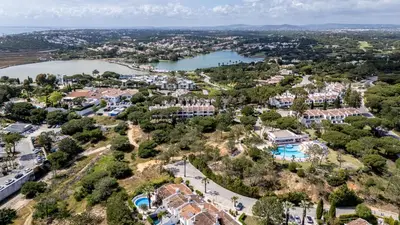 an aerial view of a town with a lake at The Palm Nest